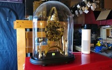 Pro Clock Skeleton Clock 011 under a very large glass dome. Hand made by myself.