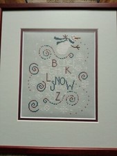 Bent Creek Snow completed Christmas cross stitch. Professionally framed.