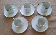 5 Thomas China White Medallion Coffee Cups and Saucers With Platinum Band used.