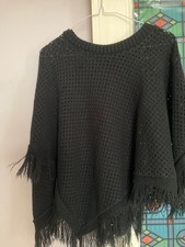 A black woollen poncho cape