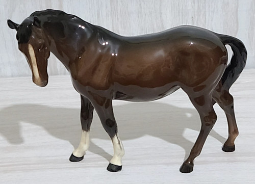 Beswick mare facing left - left, bay