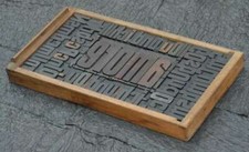 Collage "AMORE" made of letterpress type characters in old drawer Graphic Design