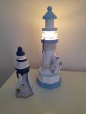 2 WOODEN LIGHTHOUSE ORNAMENTS.