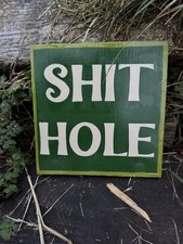 Hand painted  sh.t hole  sign writing sign in green 