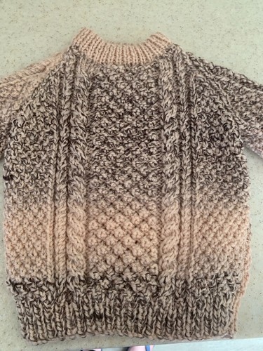Hand knitted childs aran
