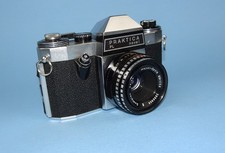 1970 Praktica PL Nova 1 SLR with Domiplan f/2.8 50mm lens. Near mint condition.