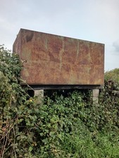 Metal Storage Tank. Used For Storing 1500 Gallons Of Diesel Fuel On Farm..
