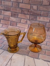 VINTAGE GLASS DUO SOWERBY JUG AND OVERSIZED BRANDY GLASS AMBER GLASS