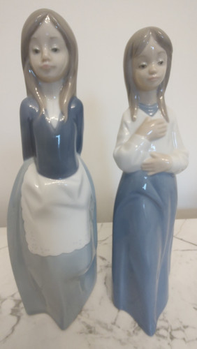 Two nao llardro figurines - by,