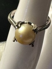 Antique Solitaire Salt Water White Pearl marked "SILVER"setting size 6