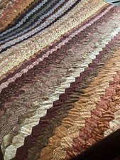 Hand crafted king size quilted bedspread in autumn colours.