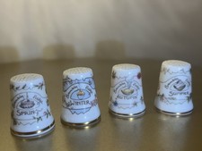 A Set Of 4 China Thimbles