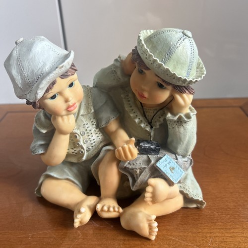 Figurine depicting two - a,