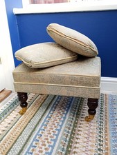 Footstool covered in teal velour plus two matching cushions. Solid brass castors