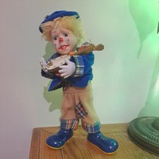 Vintage Musical Clown Wind Up Porcelain Doll Playing Ukulele Music and Moving