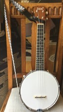Banjo Ukulele c/w professionally fitted Strap, Neck Hanger & Mute