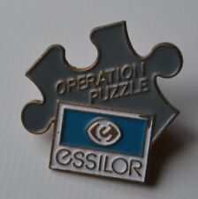 Rare Enamel Badge Pin Essilor Operation Puzzle