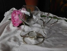 A CHARMING BRANDY GLASS ON A PLATED WARMER STAND