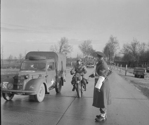 Military policeman waves - a, a