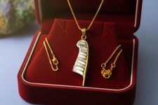 Gold maat feather pendant - maat's,