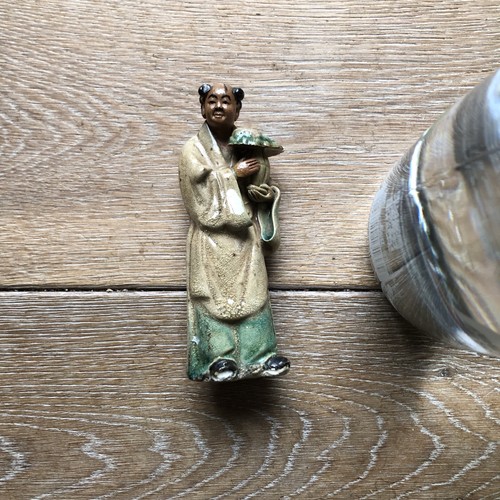 Chinese figure carrying jar - , a