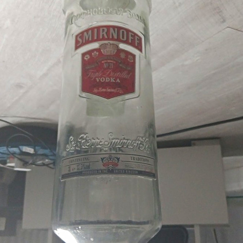 Smirnoff vodka empty glass - empty,