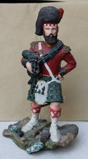 A Ceramic Figure of a Vintage Scottish Piper