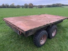 Agricultural flat bed tipping