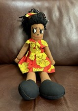 A handcrafted rag doll dressed