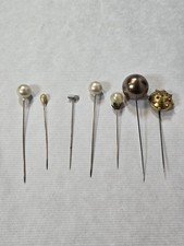 7 Vintage hat pins of various