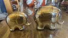 Pair of Chrome Finish Elephant ornaments.  Brass eyes and rugs. 