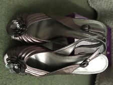 lotus ladies shoes and silver handbag