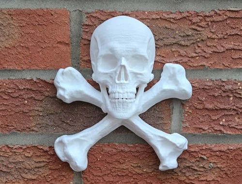 Skull and crossbones - and, wall