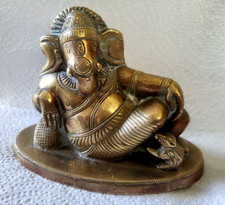 Old solid brass - brass, reclining