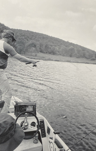 1970s fishermen men reeling - 1970s,
