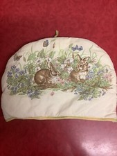 Cute Tea Cosy Rabbits Sitting Amongst Flowers and Butterflies cute for Easter