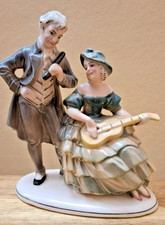 Seated Lady holding guitar