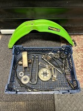Kawasaki KX60 Spares job lot. flywheel, bolts, front mudguard, foot pegs etc