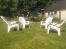 Plastic Garden Sun Loungers set of 4. White plastic. Good condition.