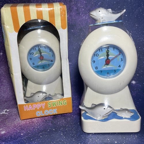 Nos moving dolphin clock - nos,