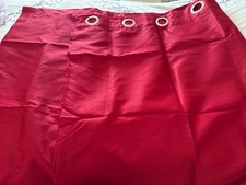 Red eyelet lined curtains