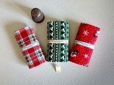Three Miniature Bolts Of Christmas Fabric