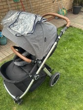 Cuggi Ebony Deluxe baby buggy with rain cover, sun protector etc