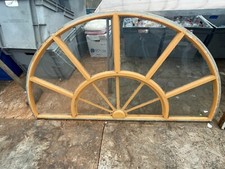 One  half circle ornamental antique wooden frame with glass.