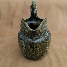 Arthur Wood, Ride of John Gilpin dark green glazed jug
