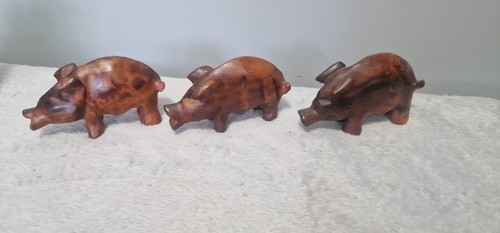 Hand carved wooden pigs - hand,