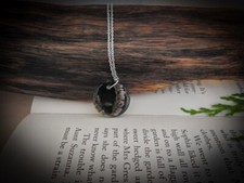 Handmade Real Ling Heather Resin Round Necklace With Black Background.