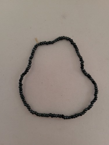 Very small pearly dark blue - pearly,