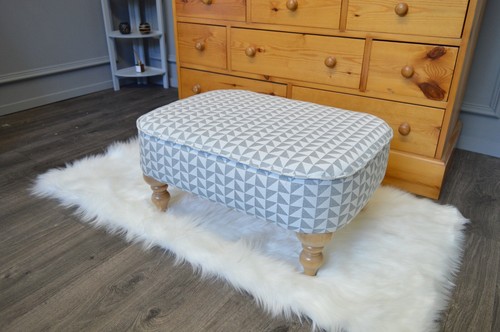 Stylish footstool with piping