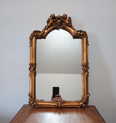 Ornate mirror featuring gilded